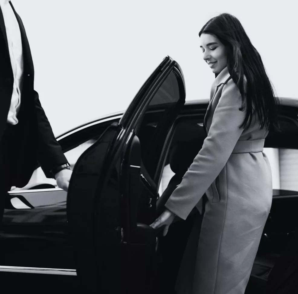 woman_taking_black_car